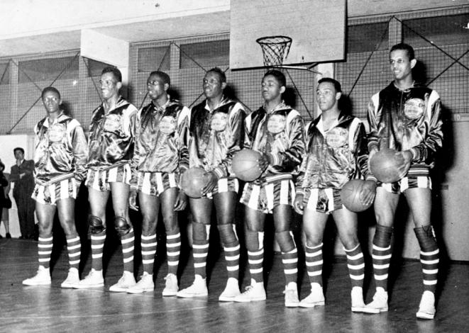 A black and white photo of the Harlem Globetrotters when they visited Paris